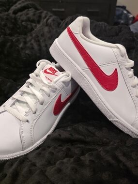 Nike Women's Court Royale sneakers in white and red.